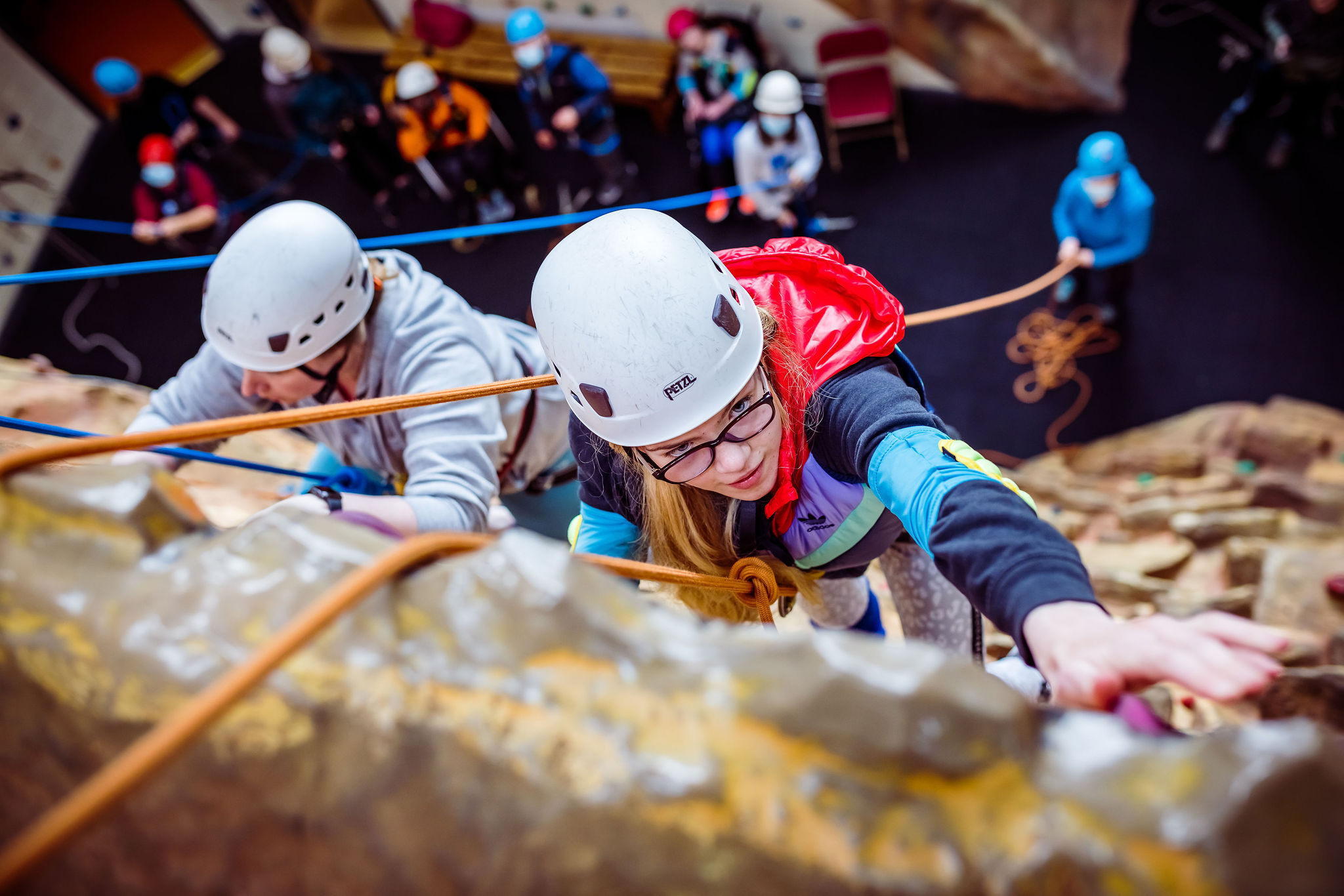 Young adults climbing at Bendrigg